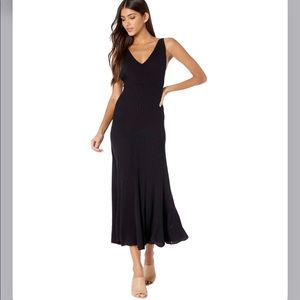 Sweet As Honey Slip Dress in Black
Free People
